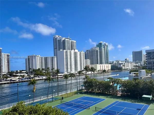 View from your balcony, overlooking the tennis courts, pool area and the Intracoastal Waterway. - Oceanview Park Condominium, Three Islands, Hallandale Beach, FL 33009. 1000 Parkview Drive, Unit #518.