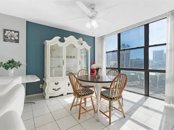 Dining corner with panorama windows. Kitchen counter with high chairs. - Oceanview Park Condominium, Three Islands, Hallandale Beach, FL 33009. 1000 Parkview Drive, Unit #518.
