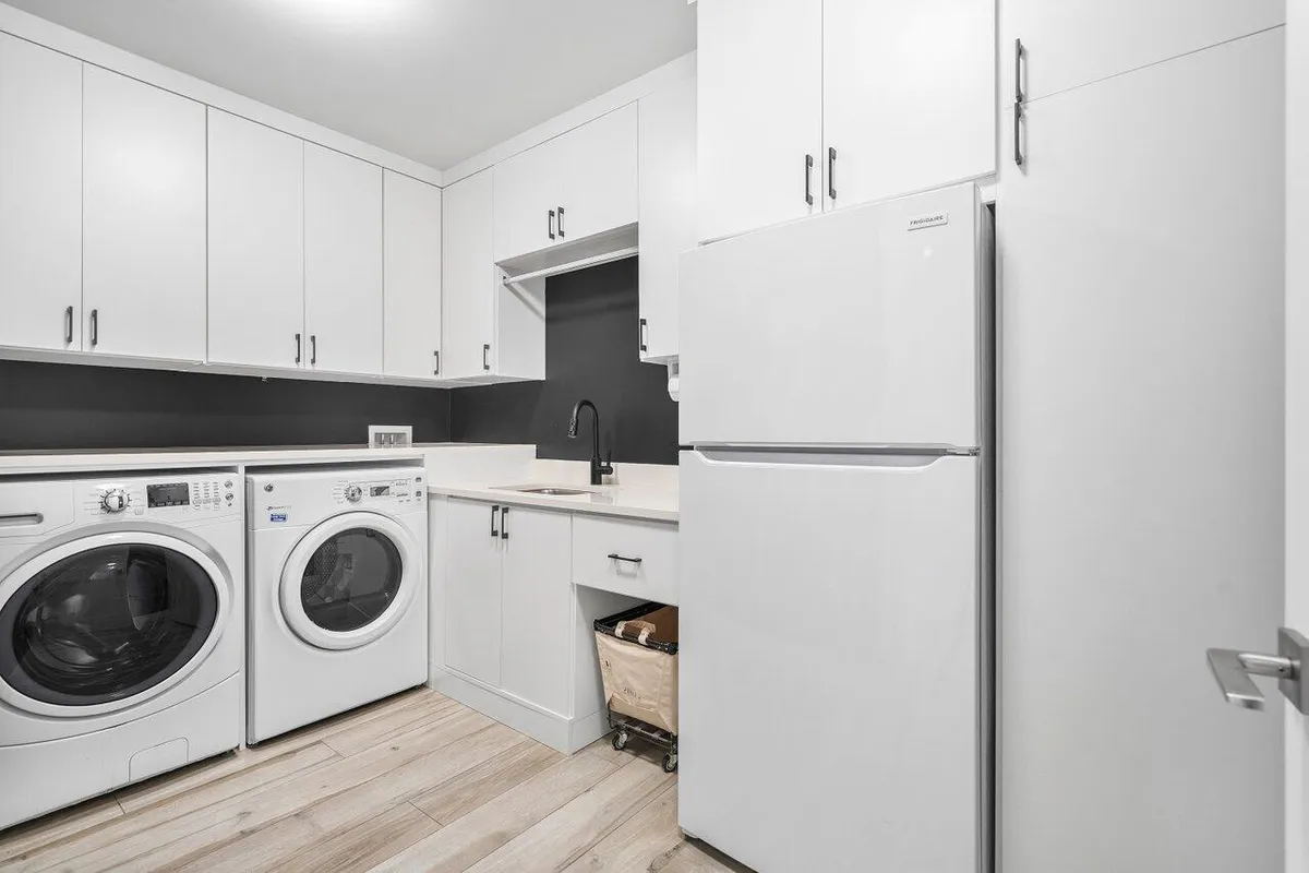 Laundry with sink and refrigerator